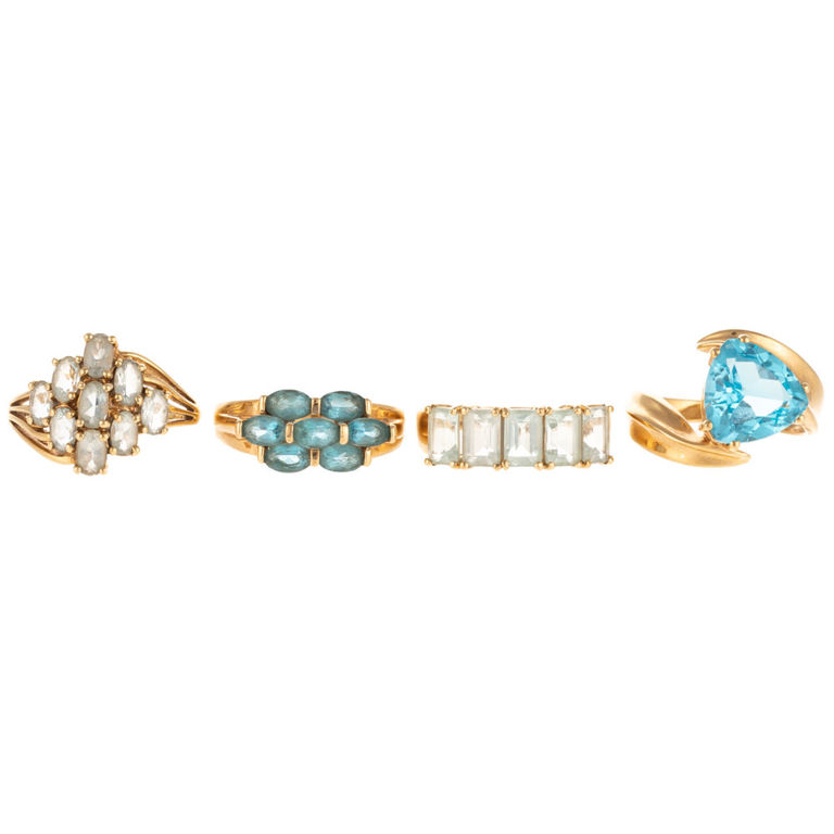 Two blue topaz and two aquamarine rings in 14k yellow gold