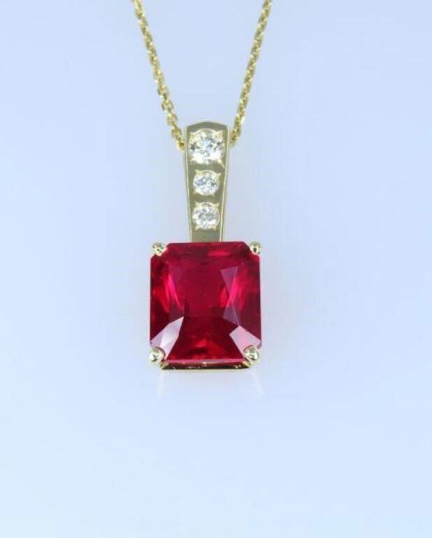 14k yellow gold ruby and diamond pendant on necklace