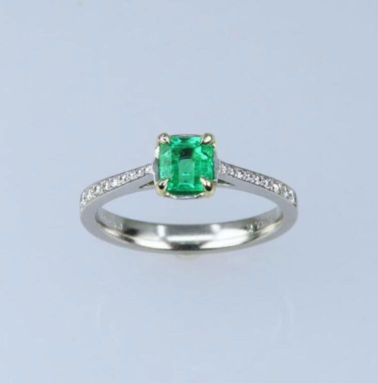 Platinum emerald and diamond ring
