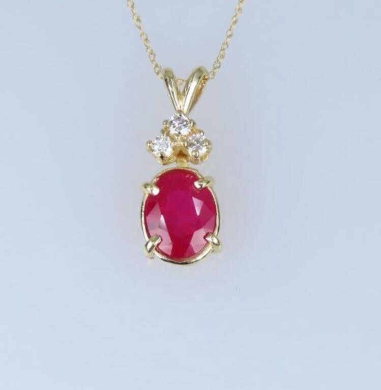 14k yellow gold ruby and diamond pendant on necklace