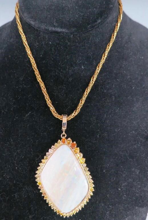14k yellow gold opal and diamond pendant on necklace
