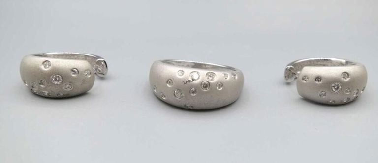 18k white gold diamond ring and matching earrings
