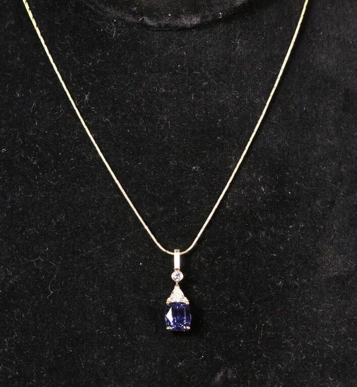 14k yellow gold blue stone and diamond pendant on necklace