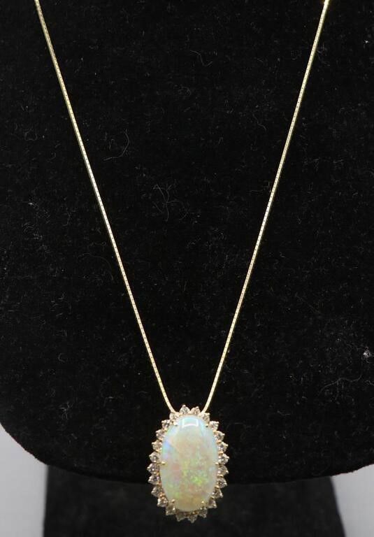 14k yellow gold opal and diamond pendant on necklace