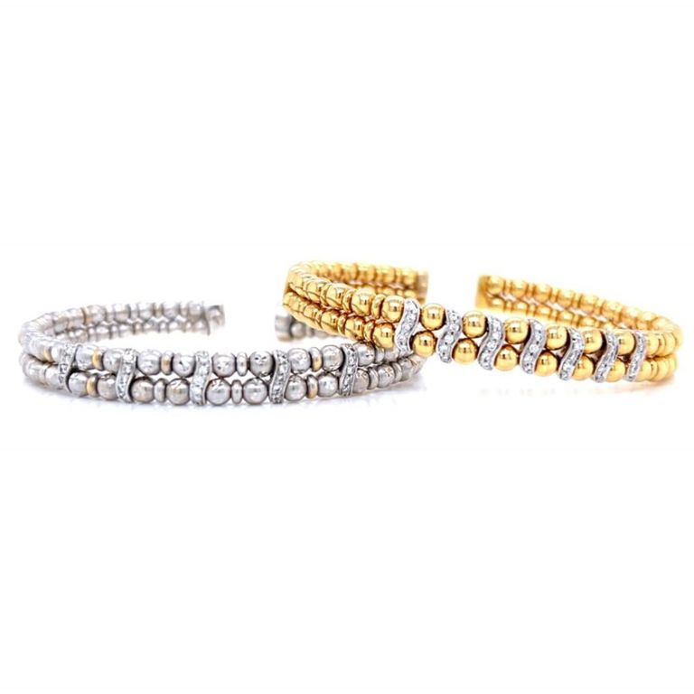Two 18k yellow and white gold diamond cuff bangle bracelets