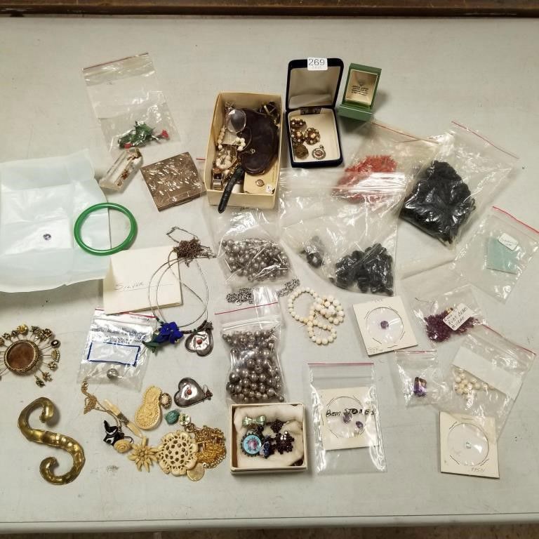 Group of loose gemstones and vintage jewelry