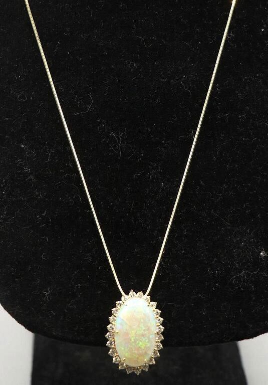 14k yellow gold opal and diamond pendant on necklace