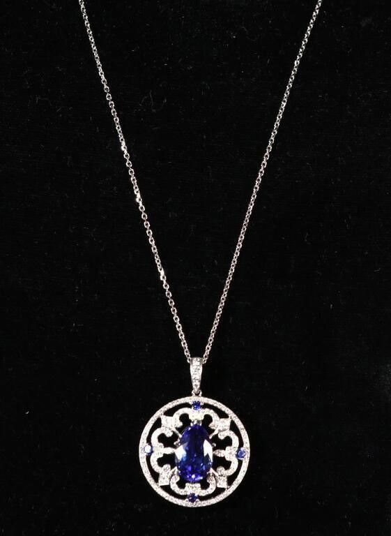 18k white gold tanzanite and diamond pendant on necklace