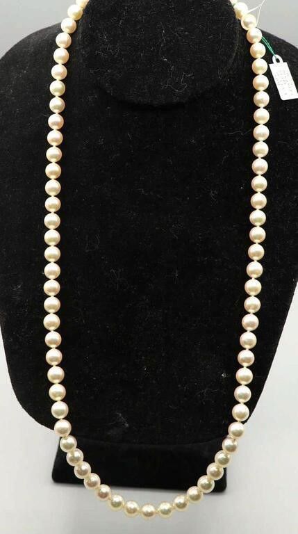 Pearl necklace with 14k yellow gold diamond and ruby clasp