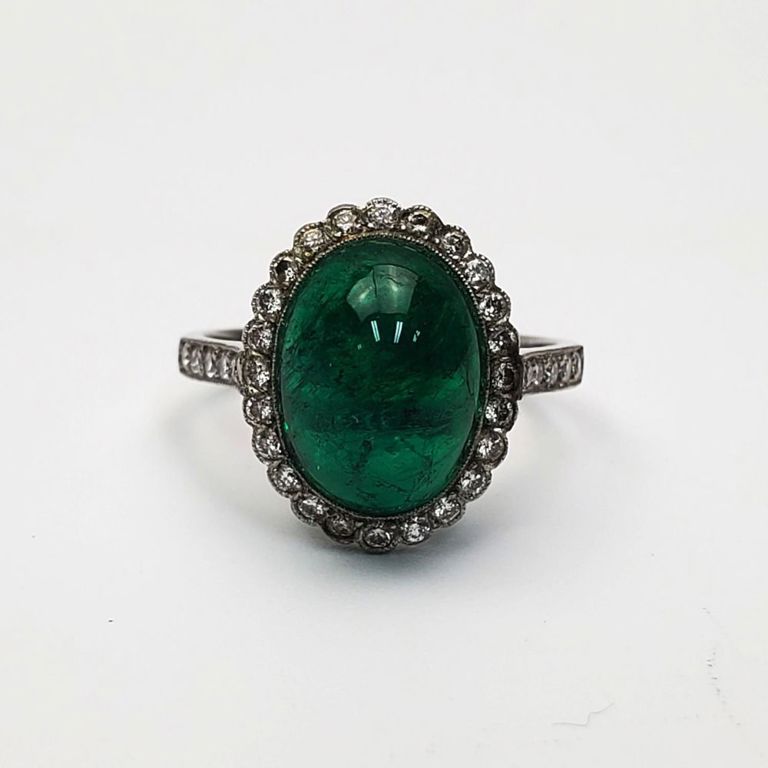 Platinum emerald and diamond ring