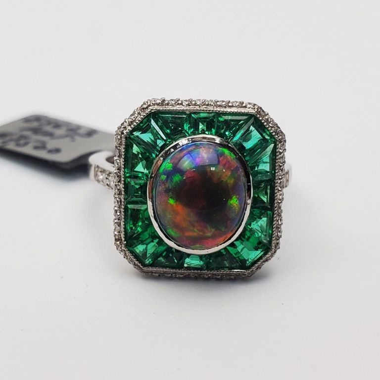 Platinum opal, emerald and diamond ring