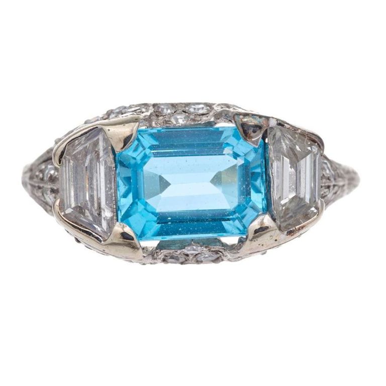 Platinum blue topaz and diamond ring