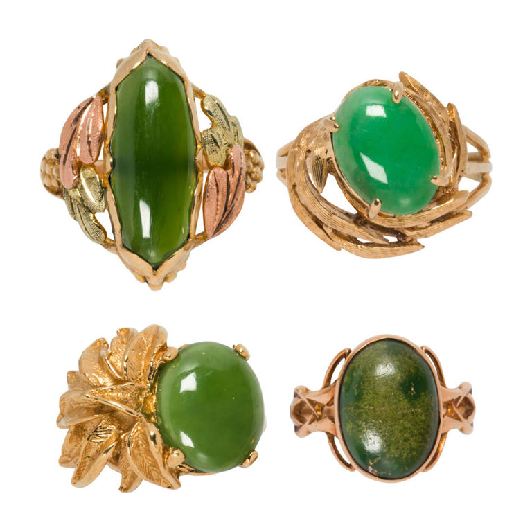 Four jade and gold rings