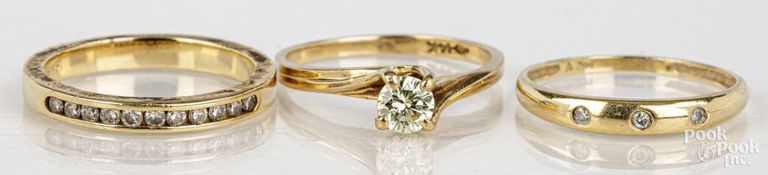 Three 14k yellow gold diamond rings