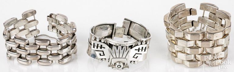Three silver bracelets