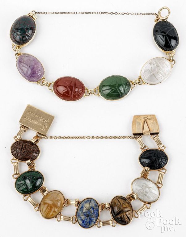 Two 14k and 10k yellow gold scarab bracelets