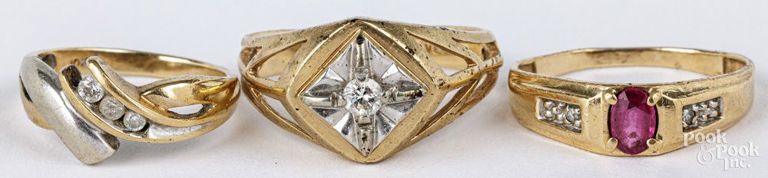 Three 10k yellow gold diamond and ruby rings