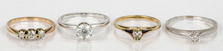 Four 18k and 14k gold rings