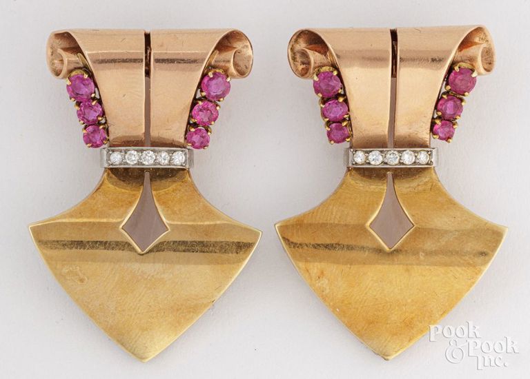 Two 14k gold ruby and diamond clip brooches
