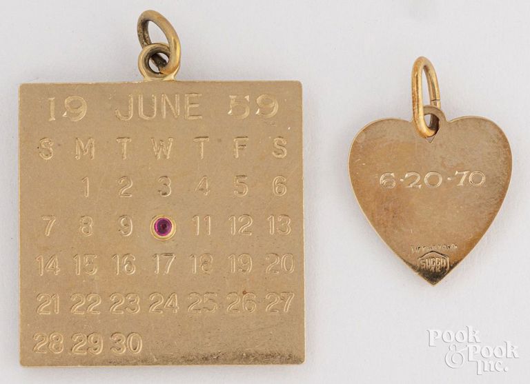 Two 14k yellow gold charm pendants