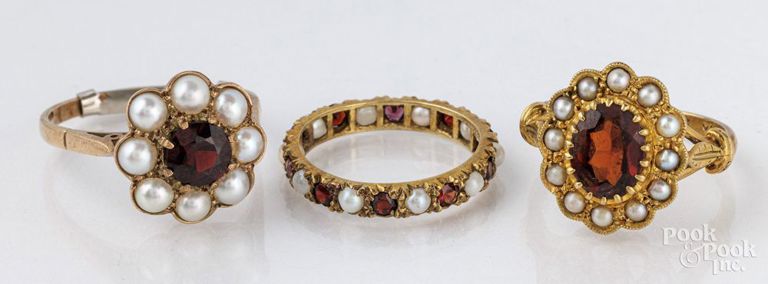 Three 14k and 10k gold garnet and pearl rings