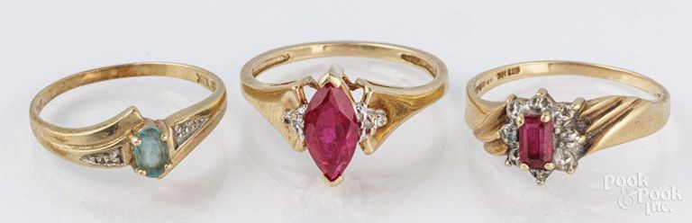 Three 10k gold multi stone rings