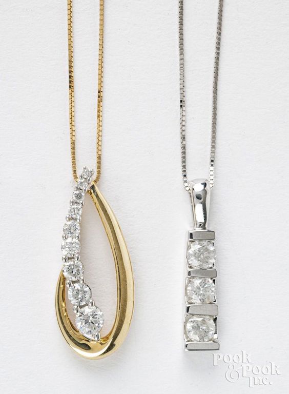 Two 14k gold diamond pendant necklaces