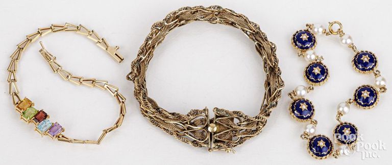 Three gold bracelets