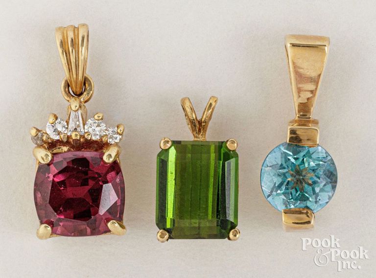 Three 14k gold pendants