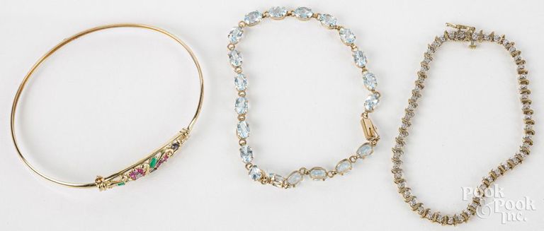 Three 10k yellow gold bracelets