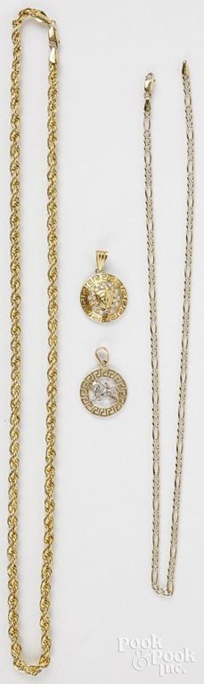 Two 10k gold necklaces, 18k gold pendant and 14k gold pendant