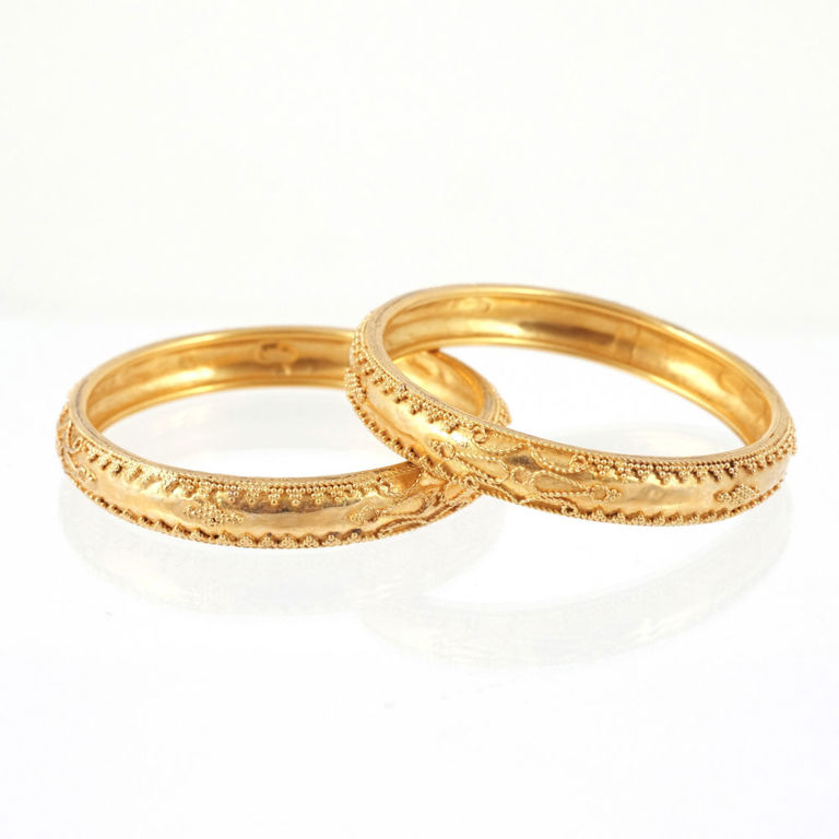 Two 18k Gold Bangle Bracelets