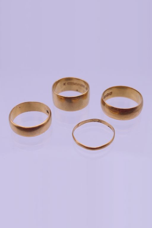 Four 22k Gold Rings