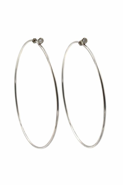 Pair of Sterling Silver Diamond Earrings
